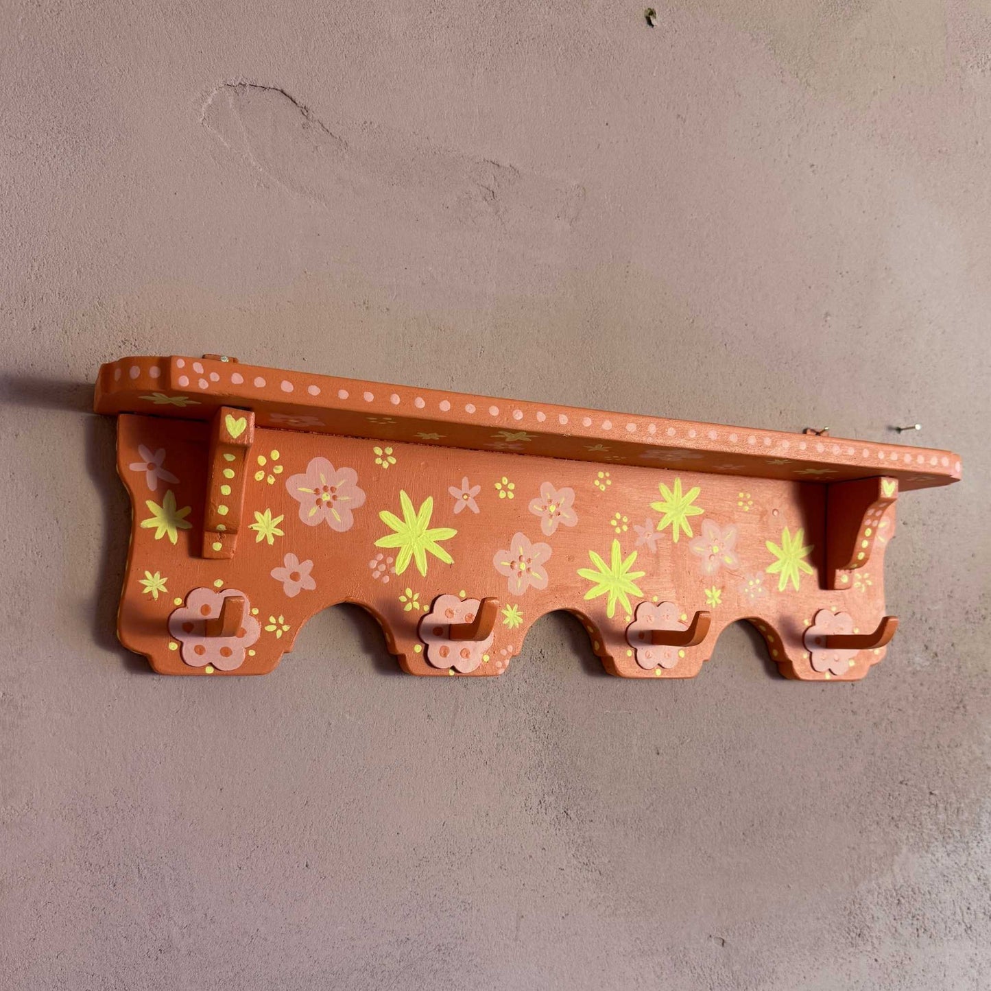 Orange coat rack