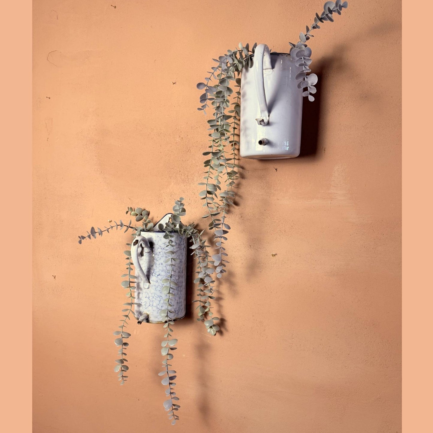 A pair of Enamelware pots