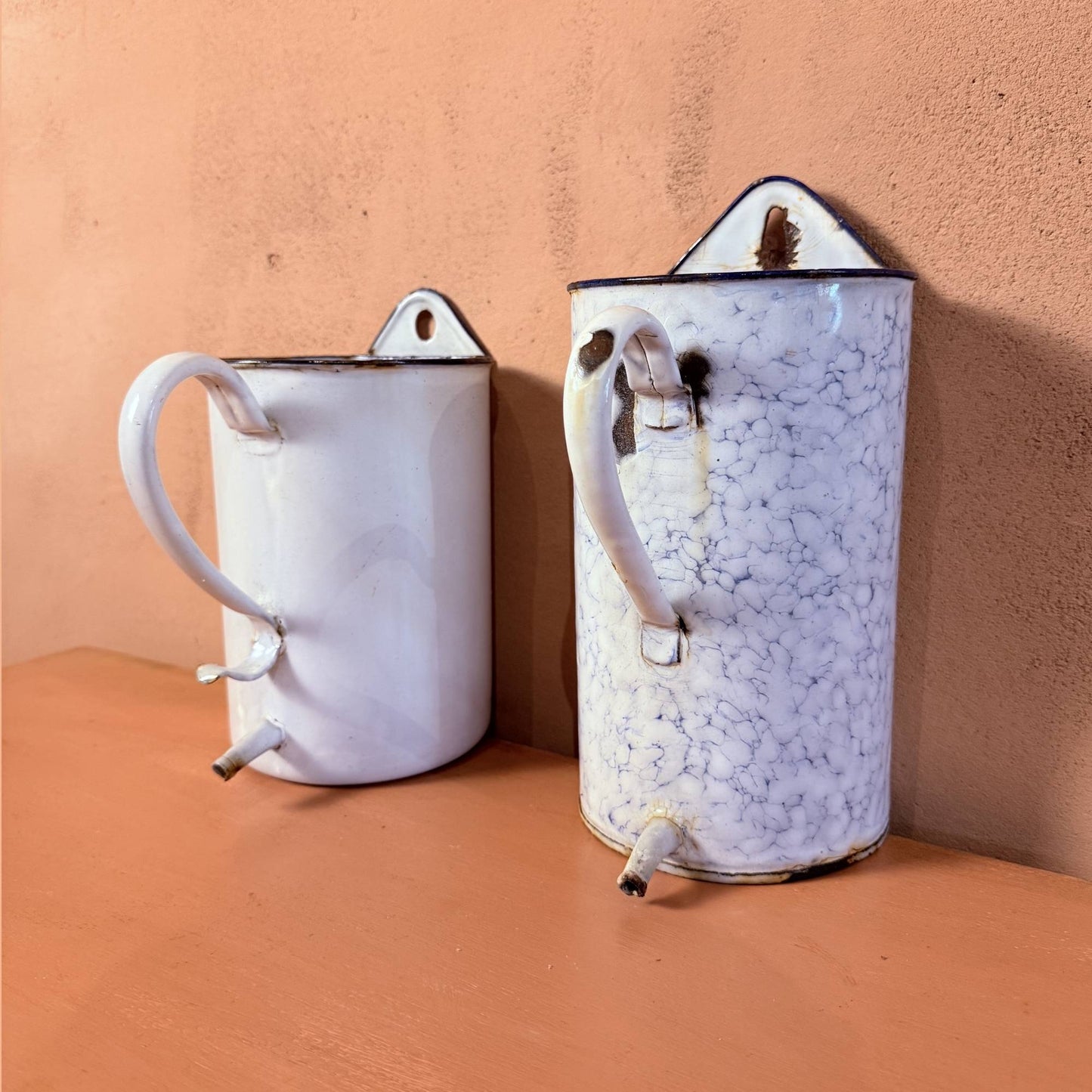 A pair of Enamelware pots