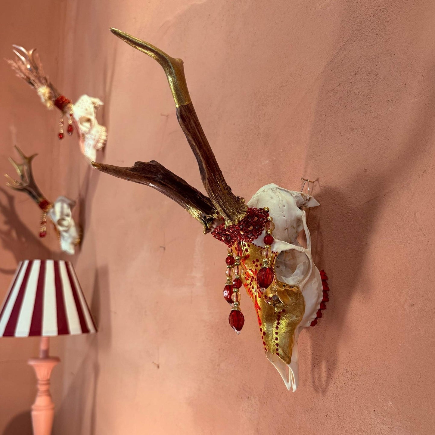 Deer skull gold & red pearls